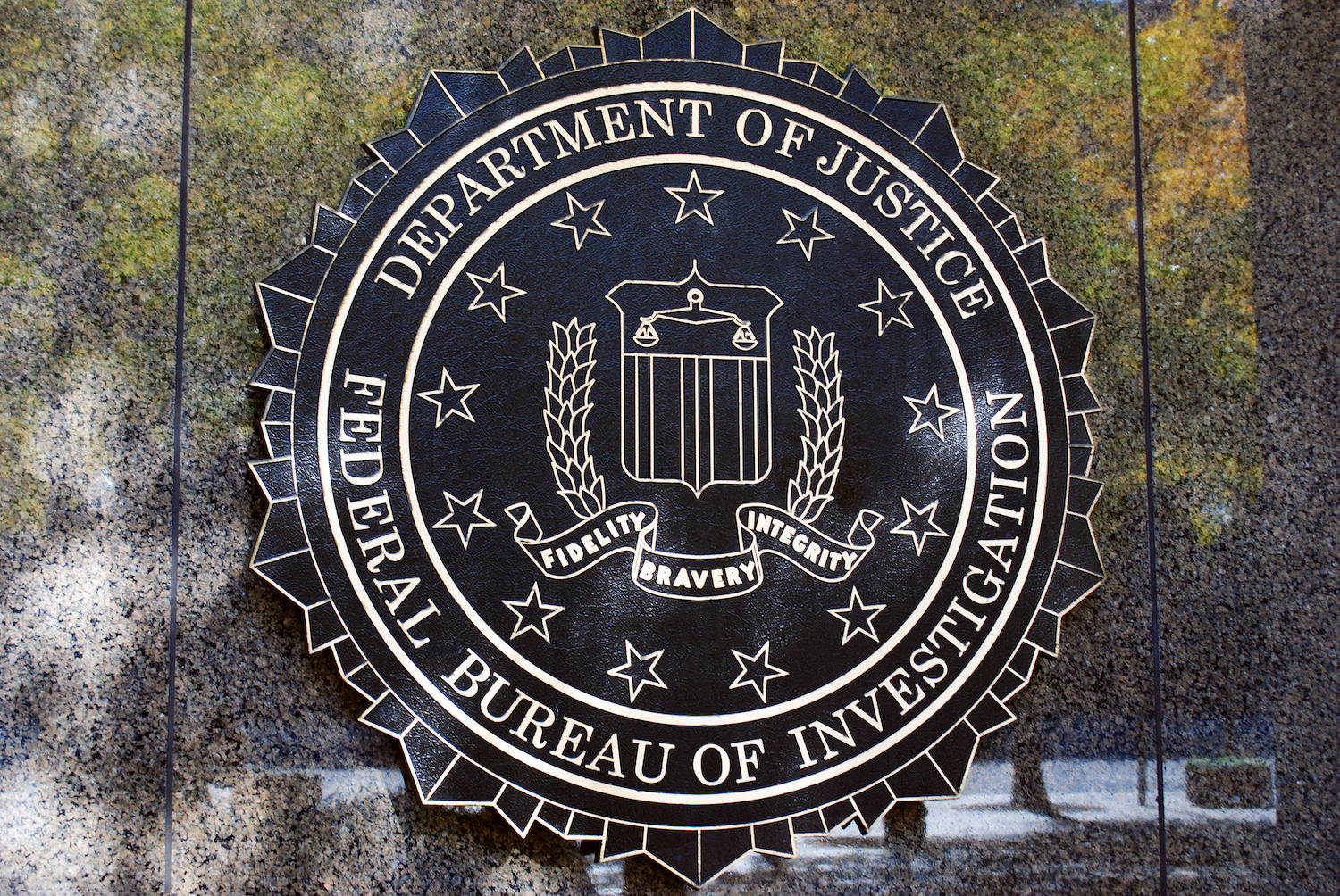 FBI sign on the building. Department of Justice, Federal Bureau of Investigation. Fidelity Bravery Integrity emblem.