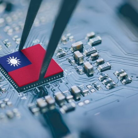 Flag of the Republic of China or Taiwan on a processor, CPU Central processing Unit or GPU microchip on a motherboard.