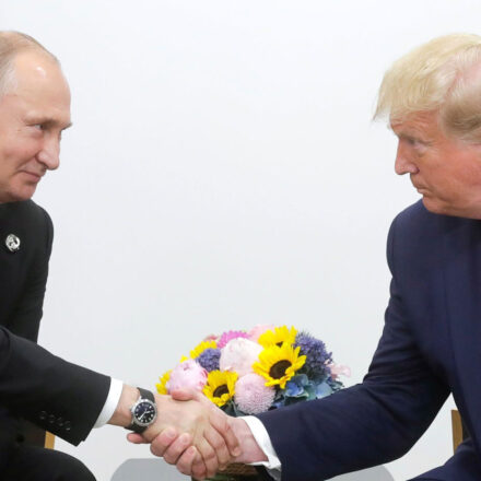 Vladimir Putin and Donald Trump shaking hands