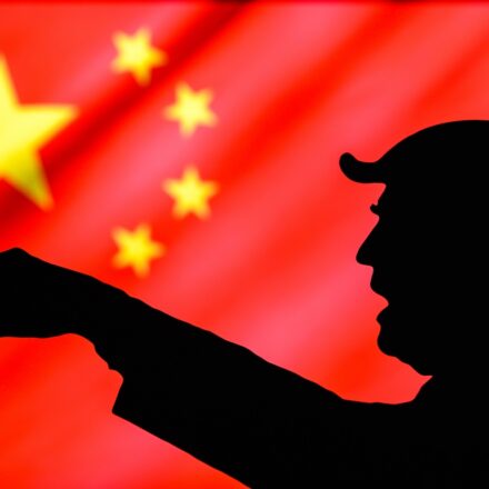 NEW YORK, USA, MAY 25, 2020: US President Donald Trump and his conflict with China. Angry Trump showing hand, flag of the Republic of China in the background. illustration photo, edit space