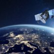 Telecommunication satellite providing global internet network and high speed data communication above Europe. Satellite in space, low Earth orbit. Worldwide communication technology.