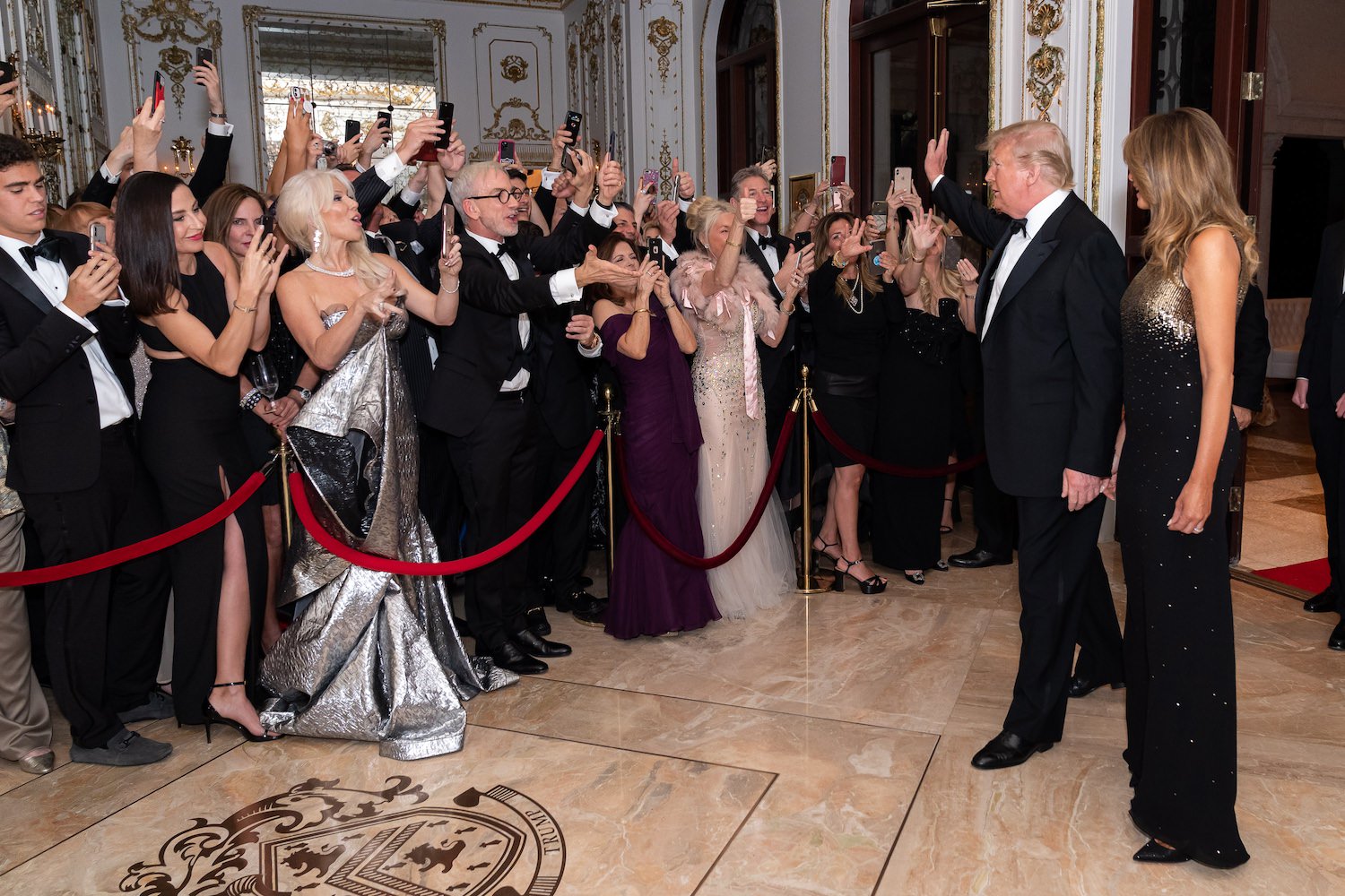 President Donald J. Trump and First Lady Melania Trump are greeted by guests as they arrive to the New Year’s Eve celebration Tuesday evening, Dec. 31, 2019, at Mar-a-Lago in Palm Beach, Fla. (Official White House Photo by Tia Dufour)