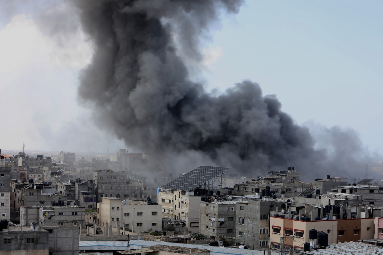 Smoke rises after Israeli air strikes near the border east of the city of Rafah in the southern Gaza Strip, on October 12 2023.