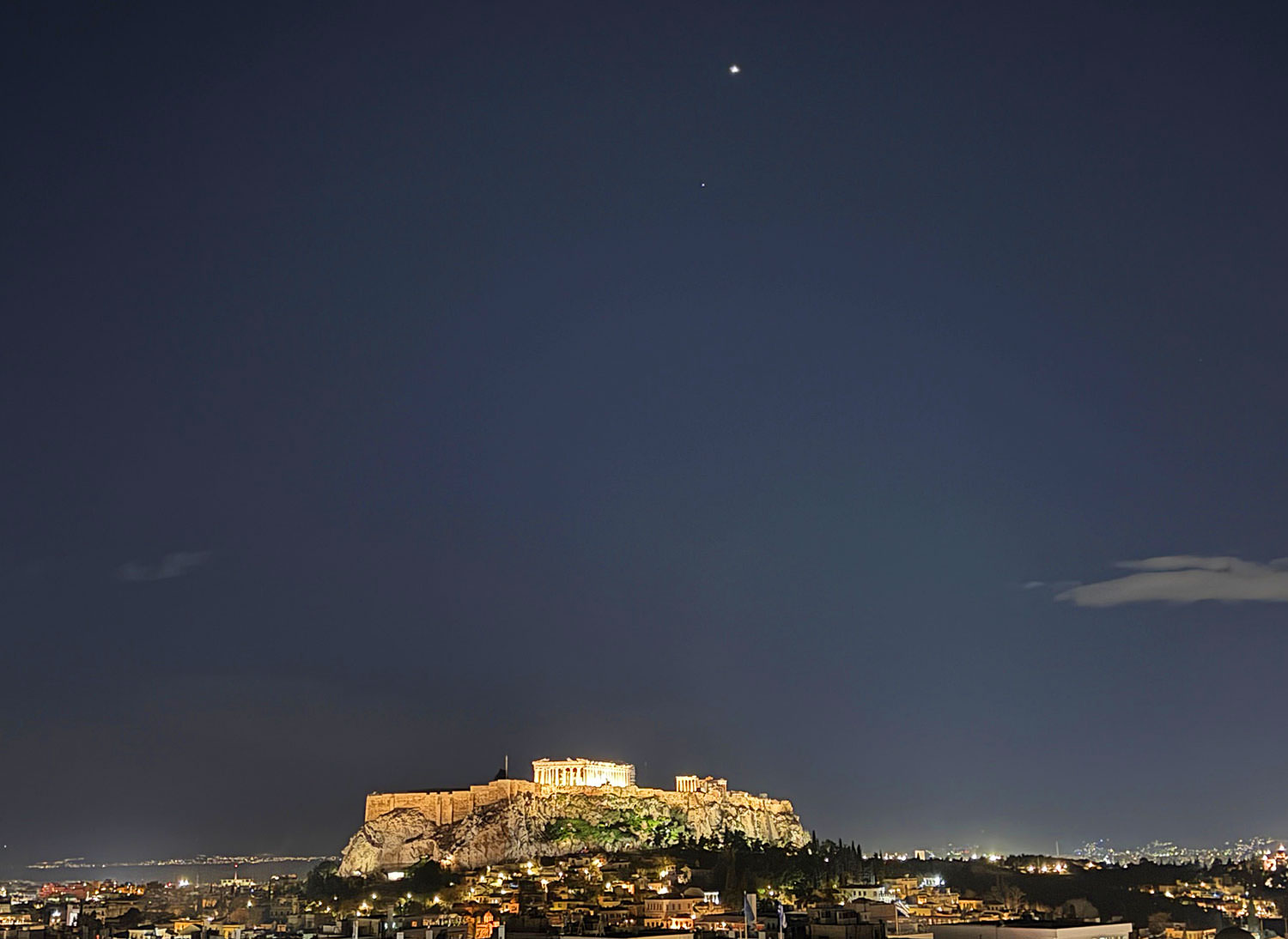 A photo of he Parthenon temple at night in Athens, Greece.