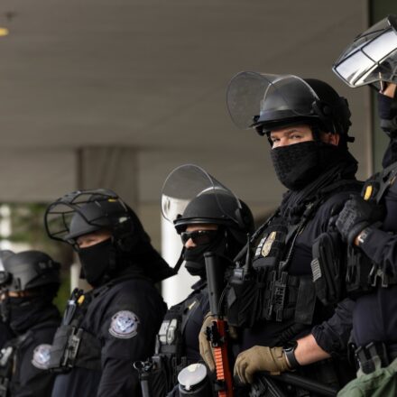 Los Angeles, California, USA - June 10, 2025: U.S. Customs and Border Protection (CBP) field officers guard a federal building during ICE deportation protests in Downtown LA.