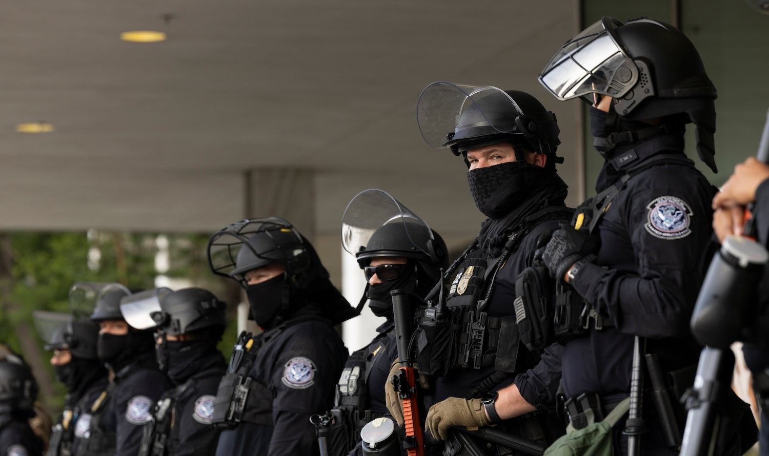 Los Angeles, California, USA - June 10, 2025: U.S. Customs and Border Protection (CBP) field officers guard a federal building during ICE deportation protests in Downtown LA.