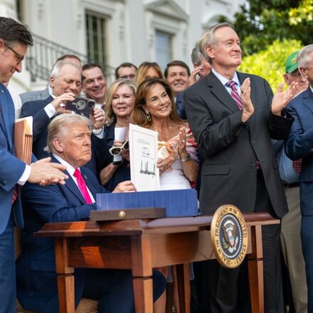 President Donald Trump signs the One Big Beautiful Bill Act on the South Lawn of the White House, Friday, July 4, 2025, during the 4th of July picnic. (Official White House Photo by Daniel Torok)