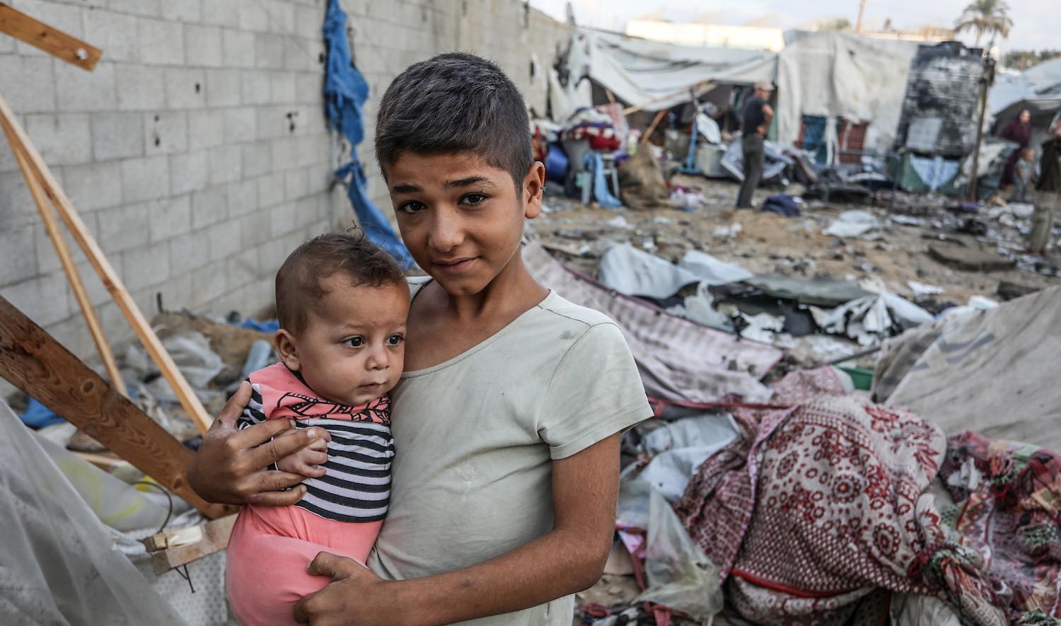 Displaced Palestinians inspect their tents, which were hit from an Israeli airstrike, inside the Al-Aqsa Hospital compound, in Deir al-Balah, central Gaza Strip, on Sep 27, 2024. Photo by Anas-Mohammed.