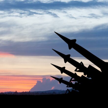 The missiles are aimed to the sky at sunset.