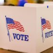 A voting booth set on a table.